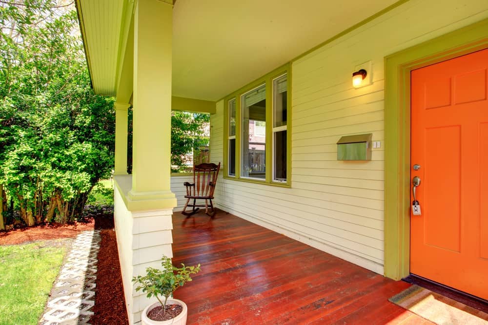 wood flooring yellow siding rocking chiar