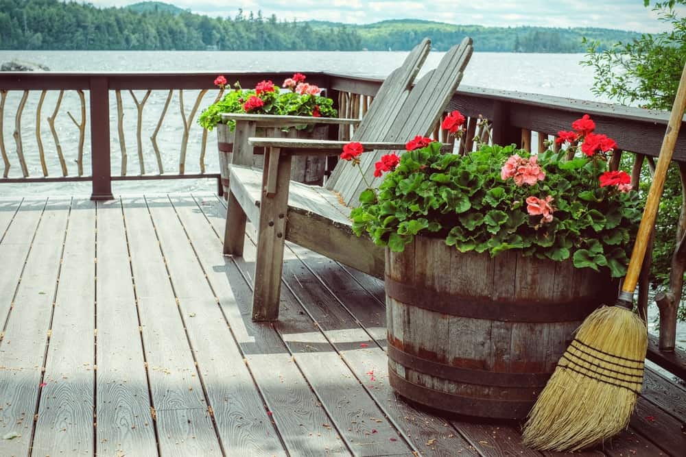 wood loveseat and barrel pots