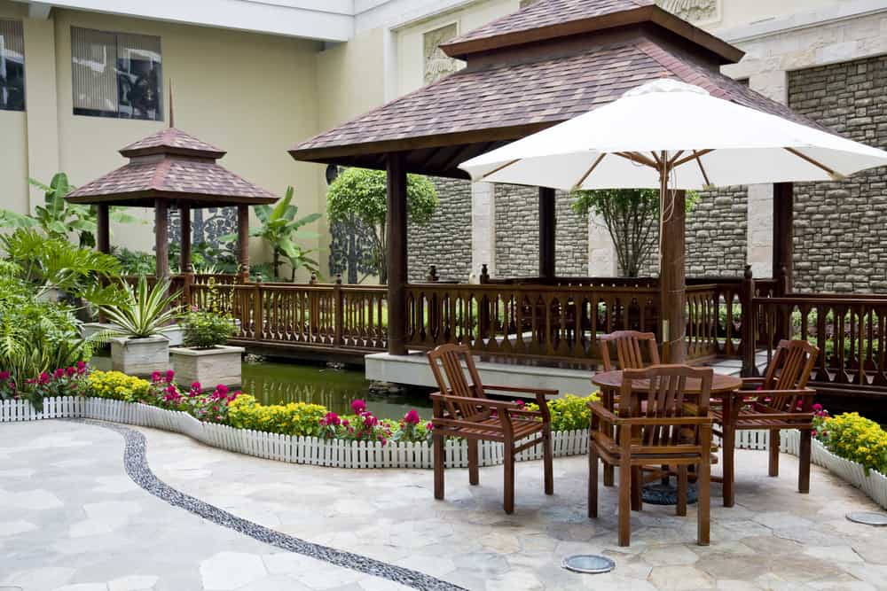 light stone gazebo and umbrella