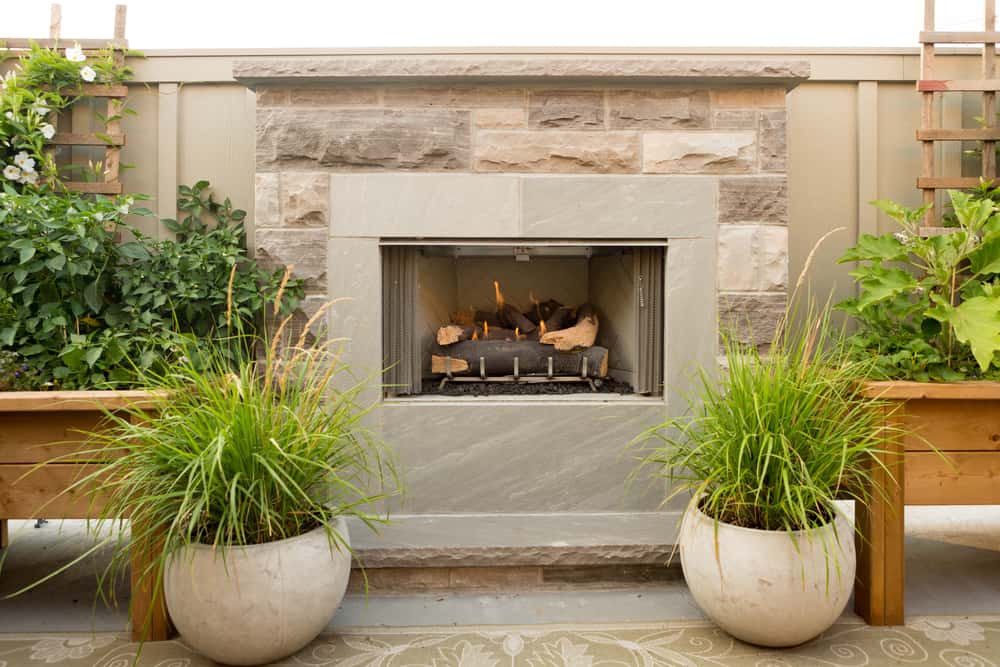 small simple brickwork fireplace plants