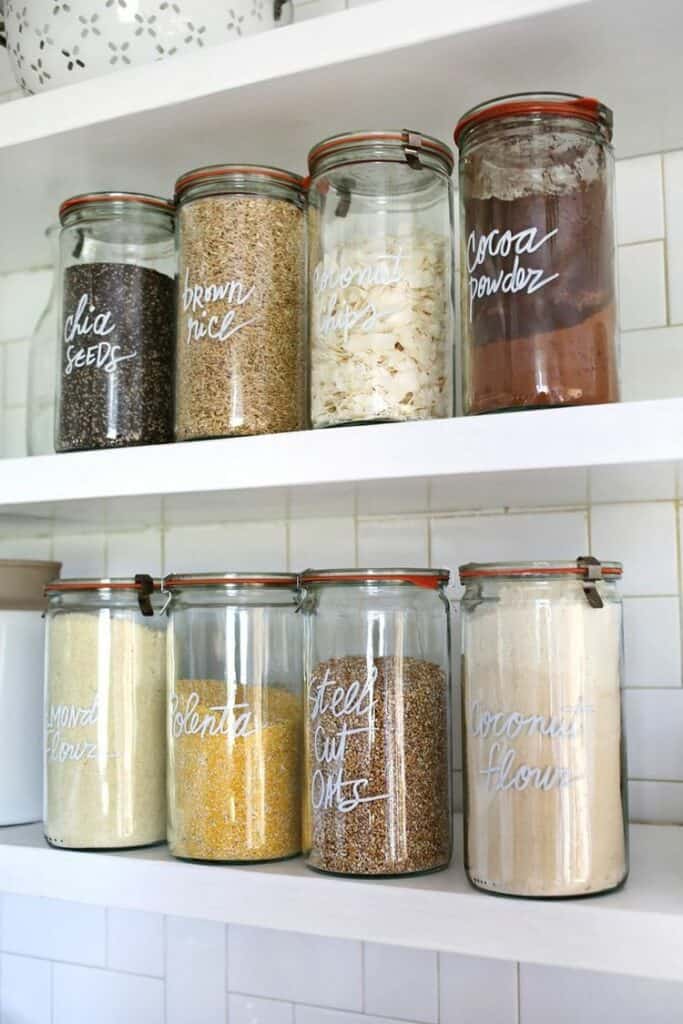 Glass Jar Organization Using glass jars to organize your food not only looks stylish, but it saves storage space. This style is perfect if you have cabinets without doors and want to decorate your kitchen too. They also give a farmhouse feel to the room. thesawguy.com