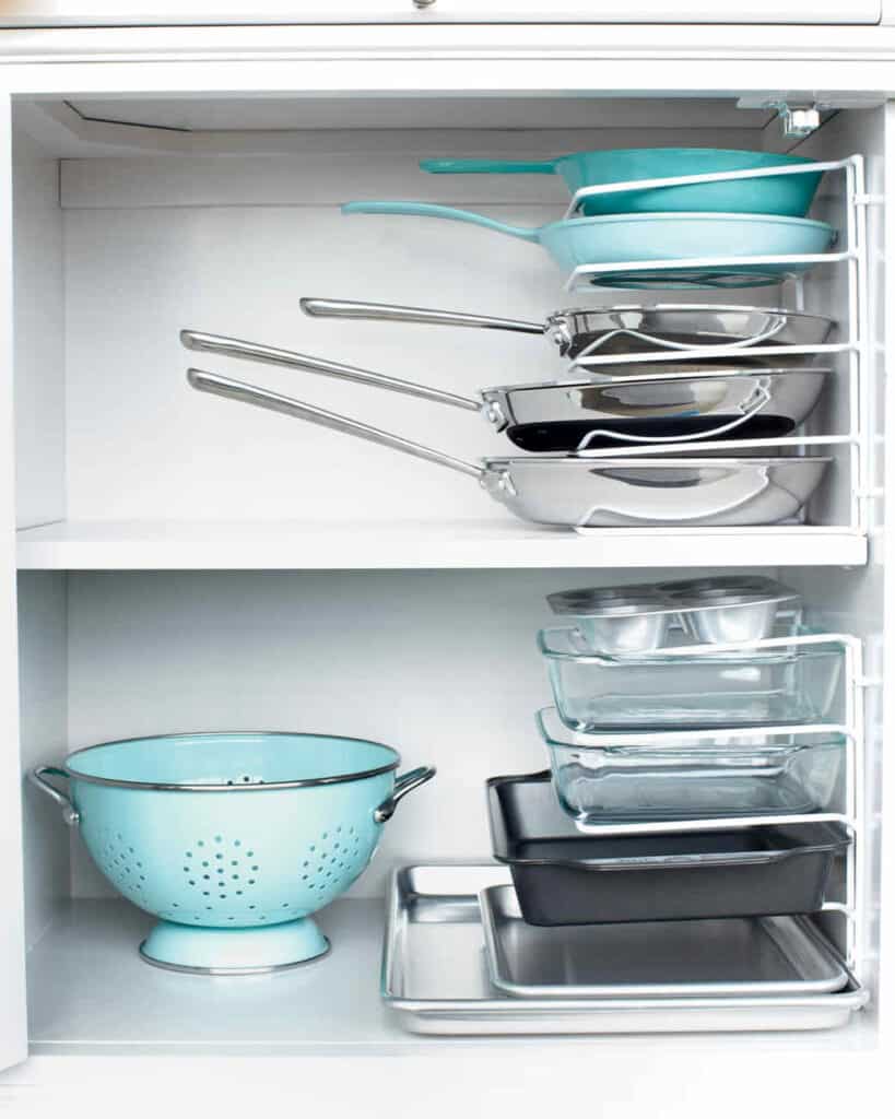 Cabinet Bakeware Storage Don’t let those pesky pans and bakeware take over your cabinet space! Use these handy stacking pan organizers and it will feel like your space has doubled. Plus, you will love that every item has a special place and the overall look. thesawguy.com