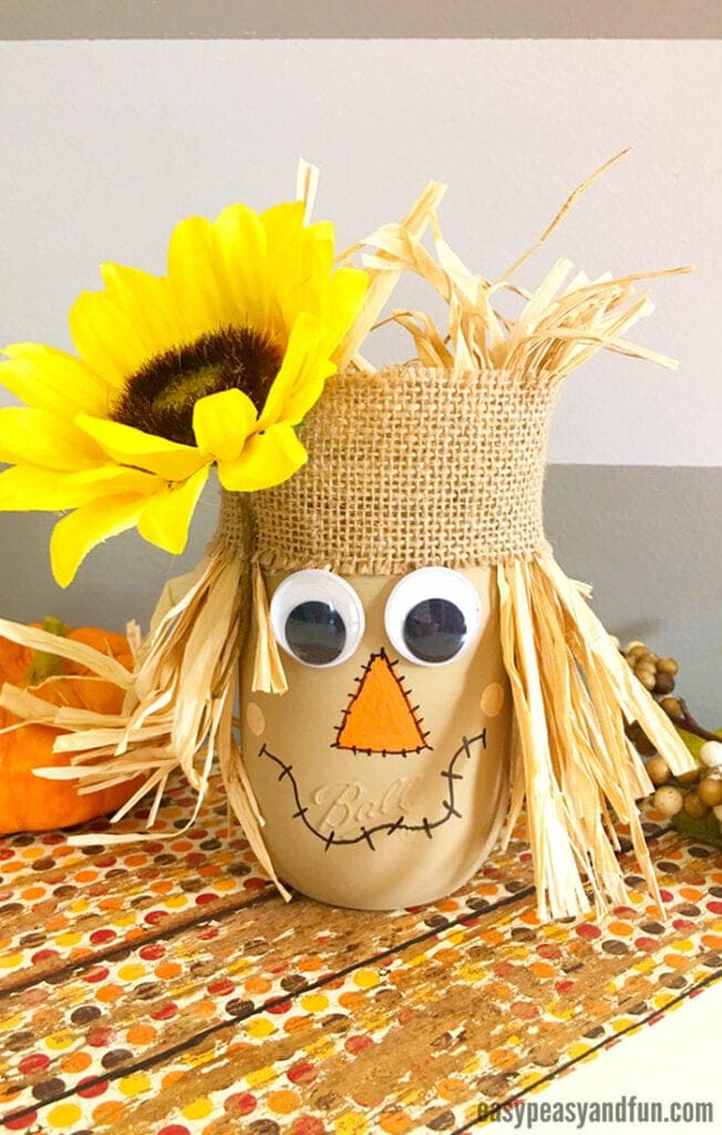 Scarecrow Mason Jar: These 25 Thanksgiving Crafts for Kids will get everyone into the thanksgiving spirit.