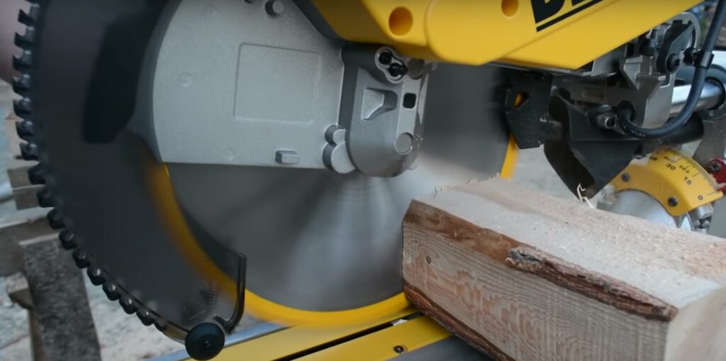 compound miter saw cutting wood